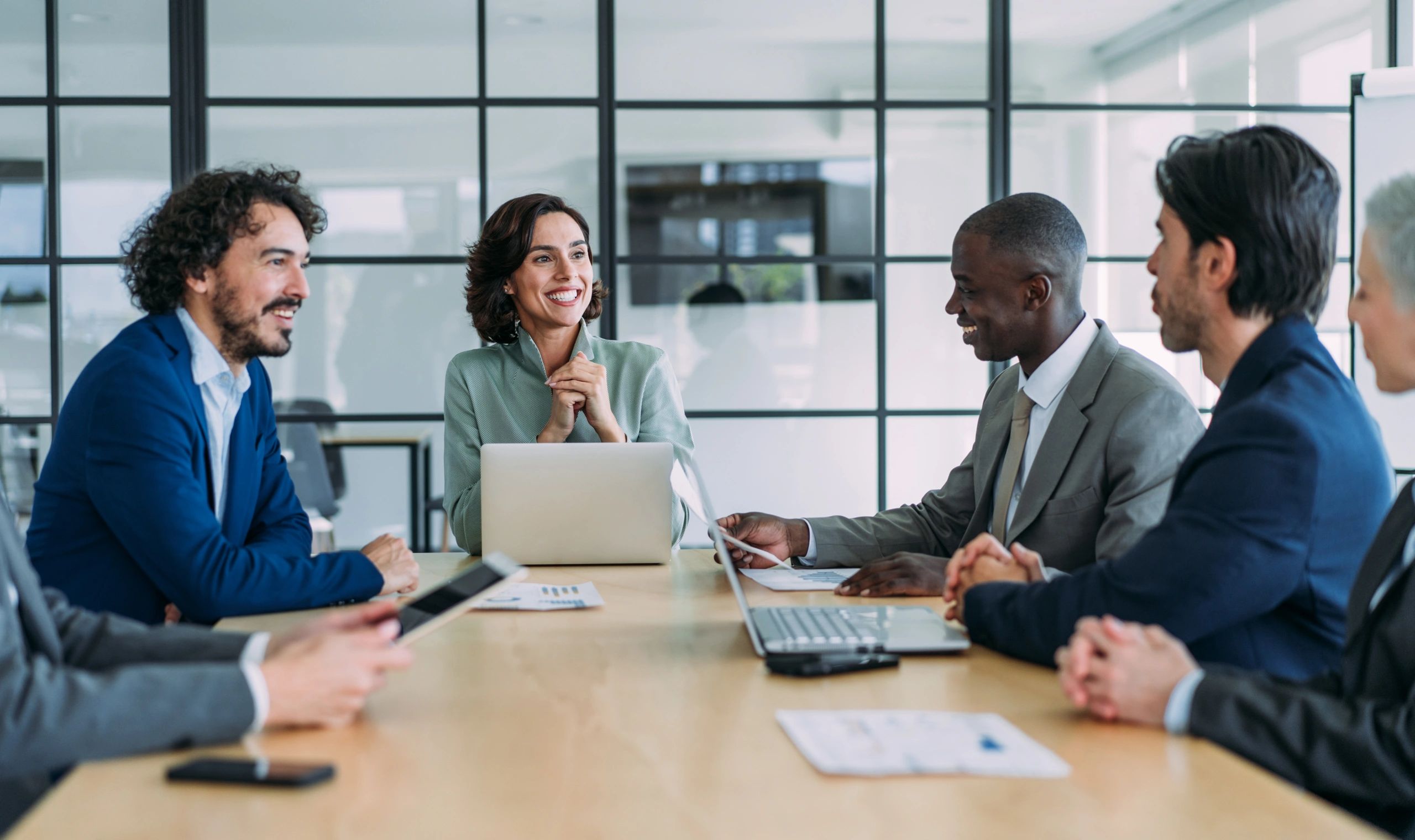 Asset management professionals collaborating in a boardroom